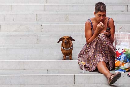 Dachshund and woman on Venice bridge