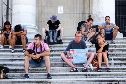 Tourists on church steps in Venice